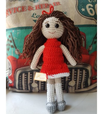 Handmade doll  in a red dress
